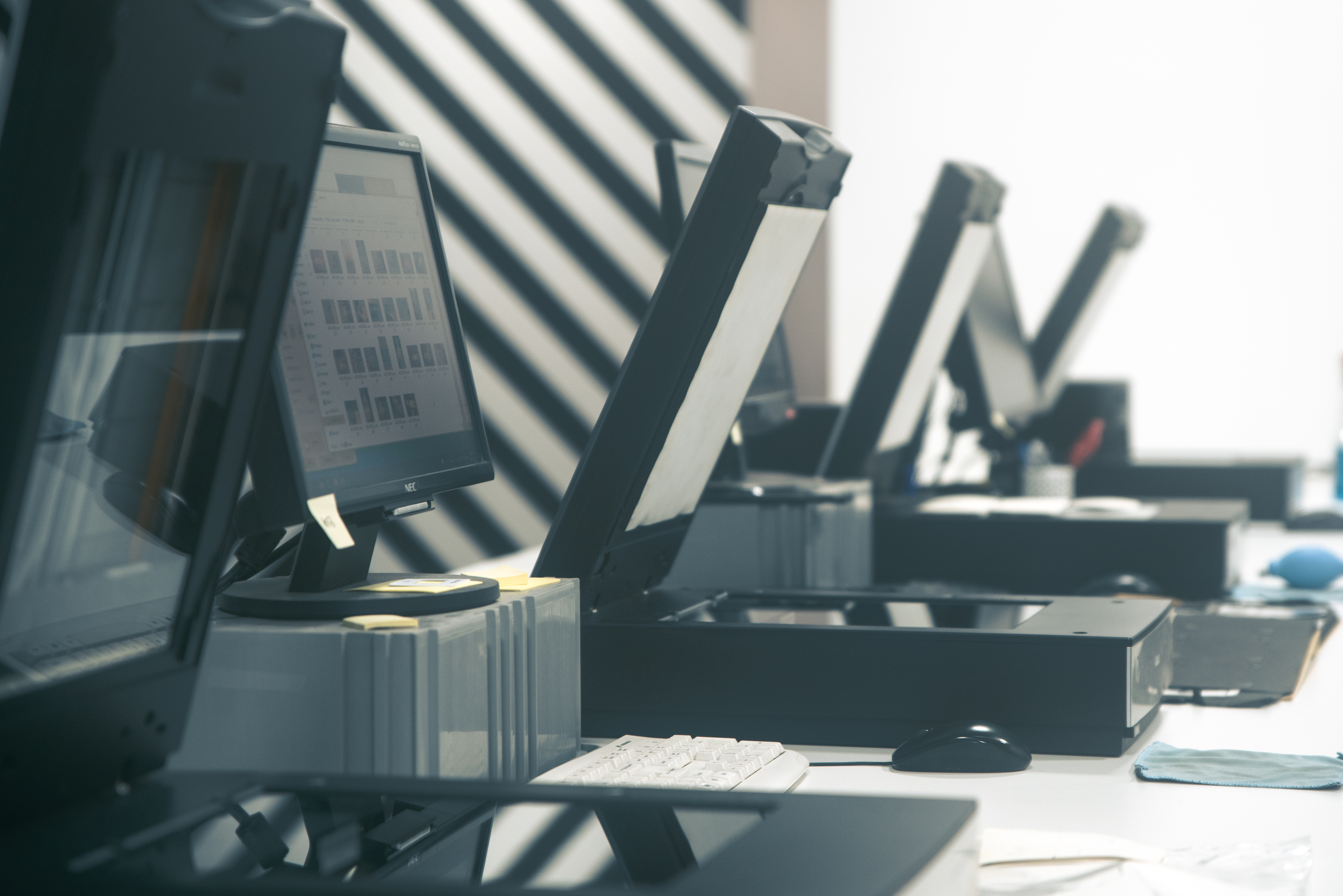 A row of photo scanners.