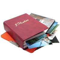 Red photo album with some photos sticking out of it