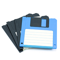 Four floppy disks stacked on top of each other